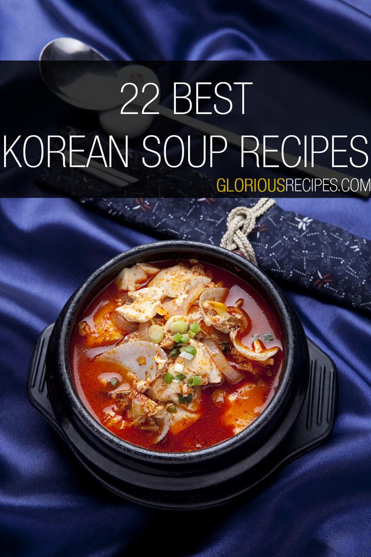 korean soup in a black bowl with chopsticks on the side and blue cloth