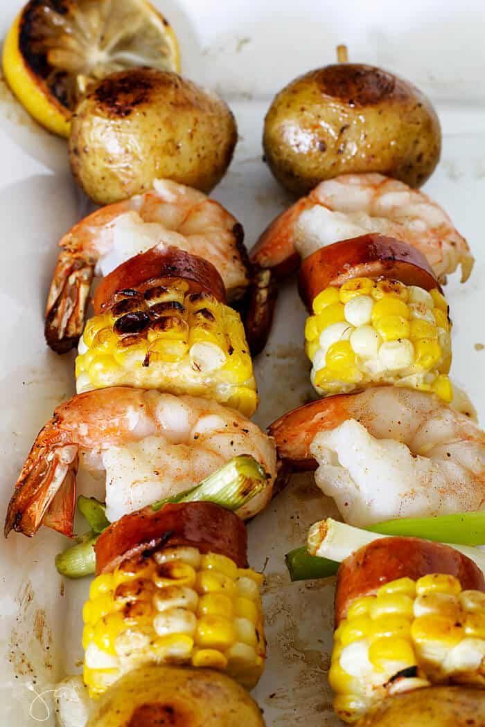 grilled shrimp and corn on the cob with potatoes