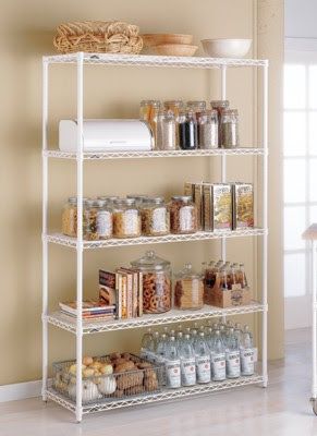 a white shelving unit filled with lots of items