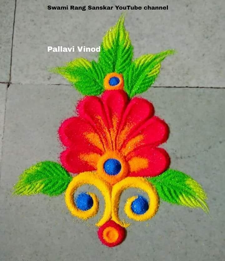 a colorful flower design made out of colored thread on the ground with words written below it