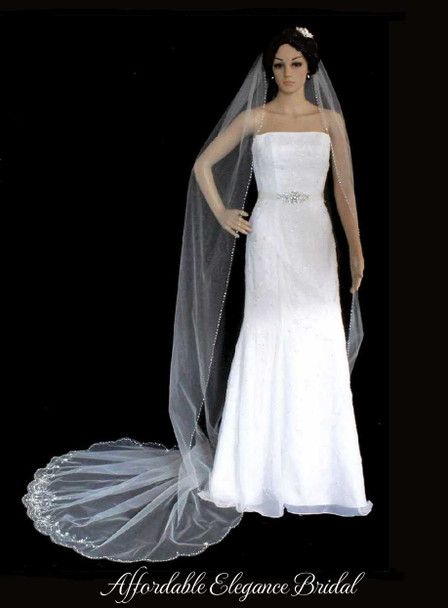 a wedding dress and veil on display in front of a black background with the words, affratable elegance bridal