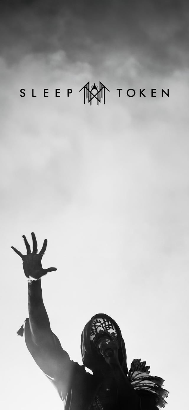 the silhouette of a man with his hands up in the air, against a cloudy sky