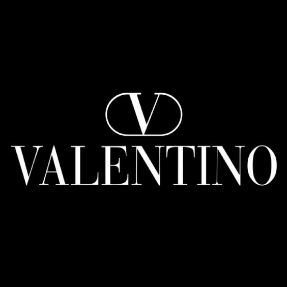 the logo for valentino is shown in black and white on a dark background