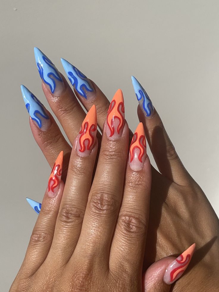 Nail design, blue flame nails and orangy red flame nails Short Flame Nails Designs, Grey Flame Nails, Blue Fire Nails Designs, Red And Orange Flame Nails, One Hand Red One Hand Blue Nails, Blue Drip Nails, Fire Themed Nails, Fire Sign Nails, Red And Blue Nails Acrylic