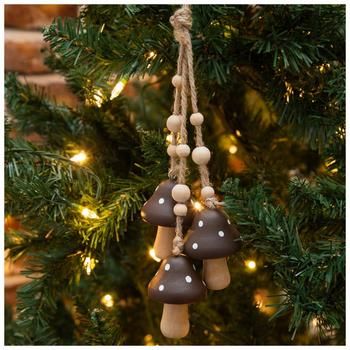 three mushrooms are hanging from a christmas tree