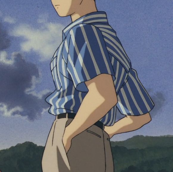 a man standing in front of the sky with his hands on his hips looking at something