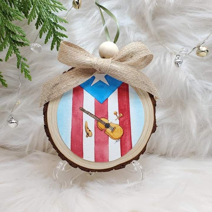 a wooden ornament with an american flag design and a guitar hanging from it