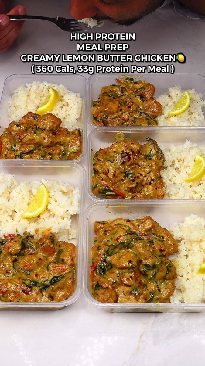 four plastic containers filled with food on top of a white countertop next to rice and lemon wedges