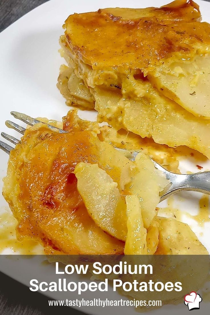 a white plate topped with food next to a fork