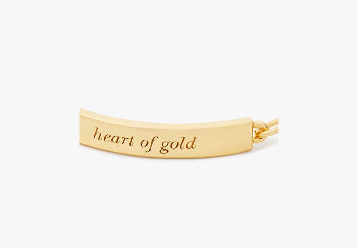 Our classic ID bracelet celebrates some of our favorites turns of phrase. This minimalist gold-tone one is engraved with some sweet words: heart of gold. (We mean yours by the way.) | Kate Spade Heart Of Gold Id Bracelet Classic Gold Bracelets For Valentine's Day, Gold Name Bracelet With Heart Charm For Anniversary, Gold Jewelry With Hallmark, Gold Heart-shaped Name Bracelet For Everyday, Everyday Gold Heart Name Bracelet, Personalized Gold-tone Bracelets As A Gift, Inspirational Gold Name Bracelet For Personalized Gift, Classic Gold Heart Bracelet As Gift, Adjustable Gold Name Bracelet