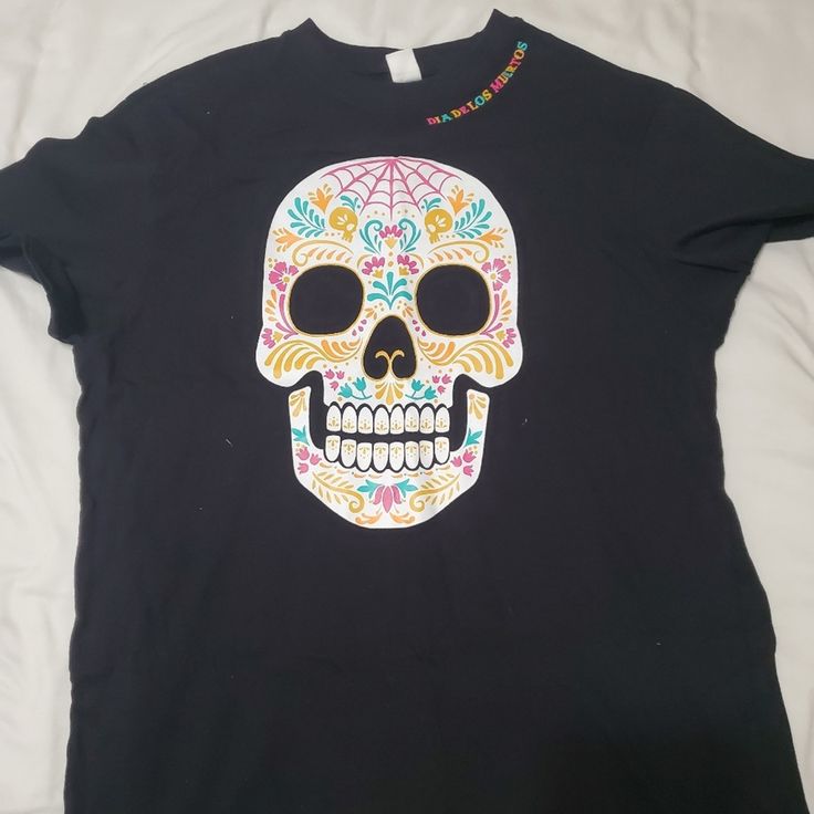 Dia De Los Muertos Tshirt Large Black Graphic Tee For Festivals, Black Graphic Tee For Festival, Casual Skull Print T-shirt For Festivals, Multicolor Skull Print T-shirt With Crew Neck, Black Letter Print T-shirt For Festivals, Multicolor Crew Neck T-shirt With Skull Print, Black Halloween Festival T-shirt, Black Screen Print T-shirt For Festival, Black Graphic T-shirt For Cinco De Mayo