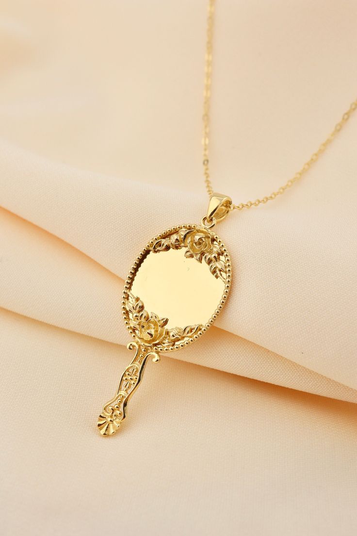 14k Solid Gold Hand Mirror Necklace - Miniature Makeup Mirror Gold Pendant This solid gold dainty Necklace is made entirely from 14k solid gold. * Jewelry is packaged and shipped in a delicate jewelry gift box. * If you are purchasing it as a gift, please feel free to add a personal note. Anniversary, Gift For Wife, Christmas Gift Gold Kt: 14K solid gold * Guaranteed Authentic 14k Gold, NOT Plated Or Filled * Stamp: 14K Elegant Gold Plated Jewelry For Birthday Gift, Elegant 14k Gold Locket Jewelry, Dainty Locket Necklace For Formal Occasions, Elegant 14k Stamped Jewelry For Valentine's Day, Vintage Jewelry For Mother's Day Gift, Vintage Jewelry Gift For Mother's Day, Vintage Mother's Day Jewelry Gift For Her, Gold Jewelry For Formal Valentine's Day Event, Engraved Jewelry For Formal Occasion On Mother's Day