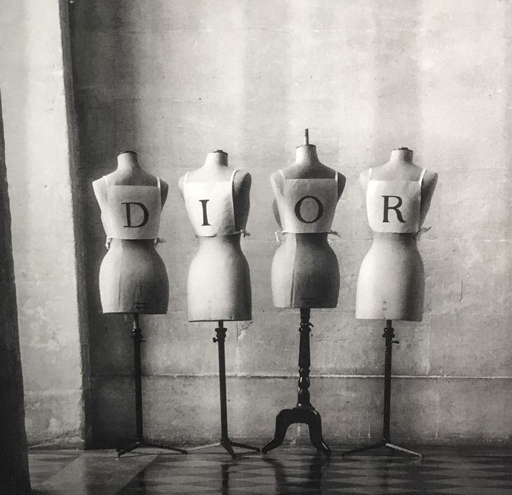 five mannequins with the word dior on them