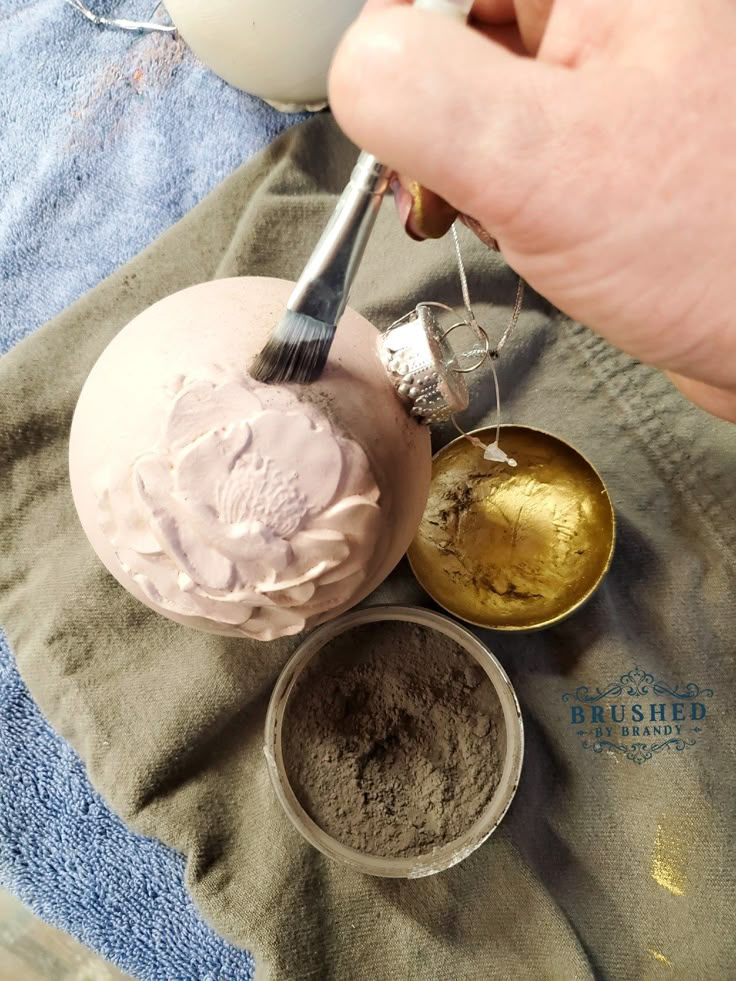 a person is using a spoon to scoop some ice cream out of a bowl and onto a towel