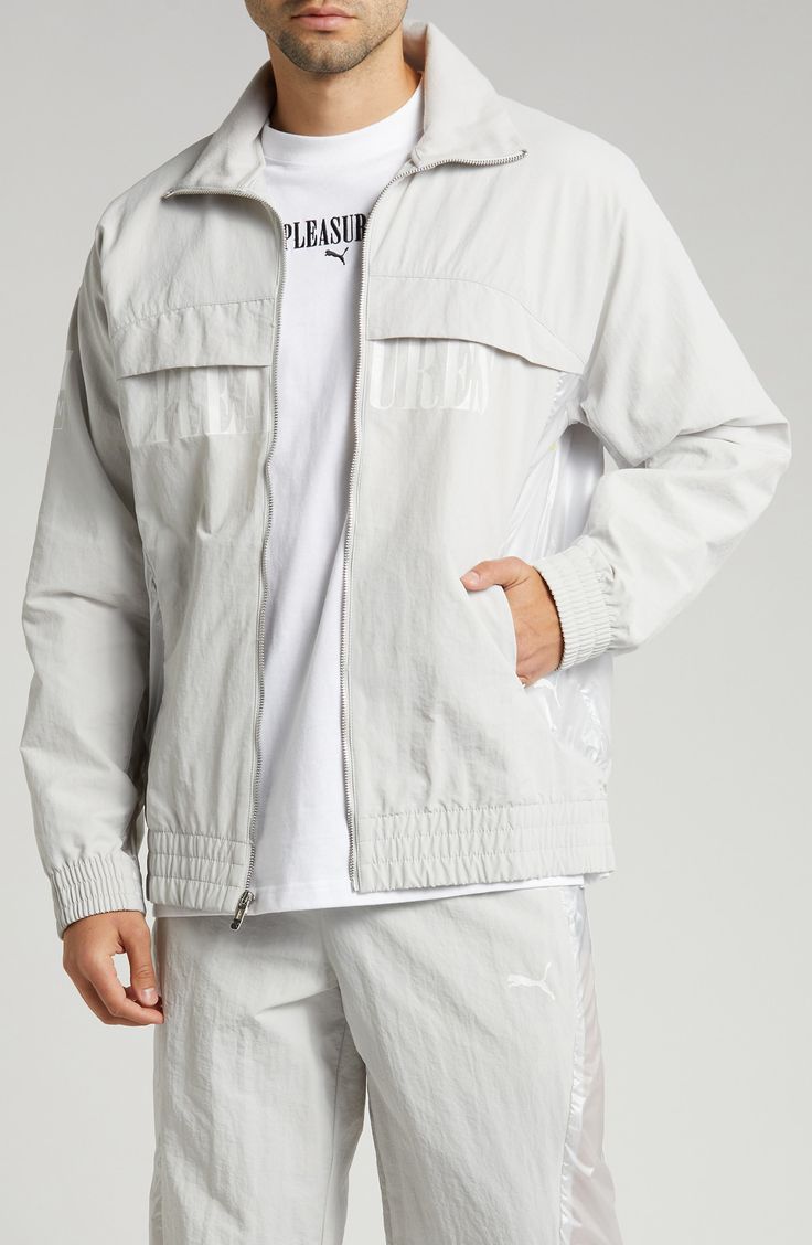 This relaxed-fit track jacket is part of a collab with PLEASURES and is inspired by a clash of racing and punk-inspired streetwear. Bold tonal branding for both labels subtly reflects against the sleek nylon on the outerwear, while underarm ventilation keeps it breathable throughout the day. 28" length (size Medium) Front zip closure Stand collar Elastic cuffs and hem Side zip pockets Underarm ventilation Water-repellent 100% recycled nylon Machine wash, tumble dry Imported PUMA has received the Punk Inspiration, Puma X, Track Jacket, Track Jackets, Stand Collar, Water Repellent, Side Zip, Zip Pockets, Denim Jacket