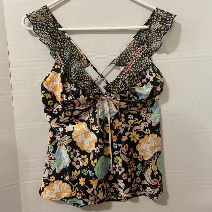 Nwt -Size Medium One -Has Pink Tie In The Front And Ruffled Floral Sleeves -Perfect Summer Top -Has A Criss Cross Back -Adjustable Straps Victoria's Secret Tops For Spring Vacation, Victoria's Secret Tops For Summer Night Out, Chic Victoria's Secret Tops For Beach, Victoria's Secret Black Tops For Spring, Victoria's Secret Spring Vacation Tops, Summer Floral Print Tops By Victoria's Secret, Victoria's Secret V-neck Party Top, Victoria's Secret Floral Print Summer Tops, Victoria's Secret V-neck Spring Camisole