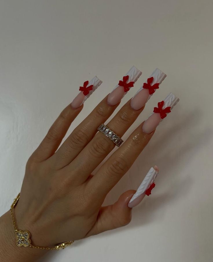 a woman's hand with red and white nails