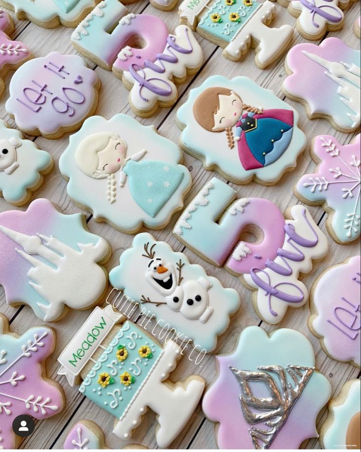 some decorated cookies are sitting on a table