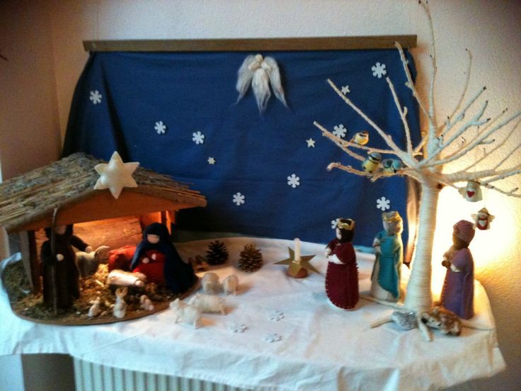 a nativity scene is displayed on a table