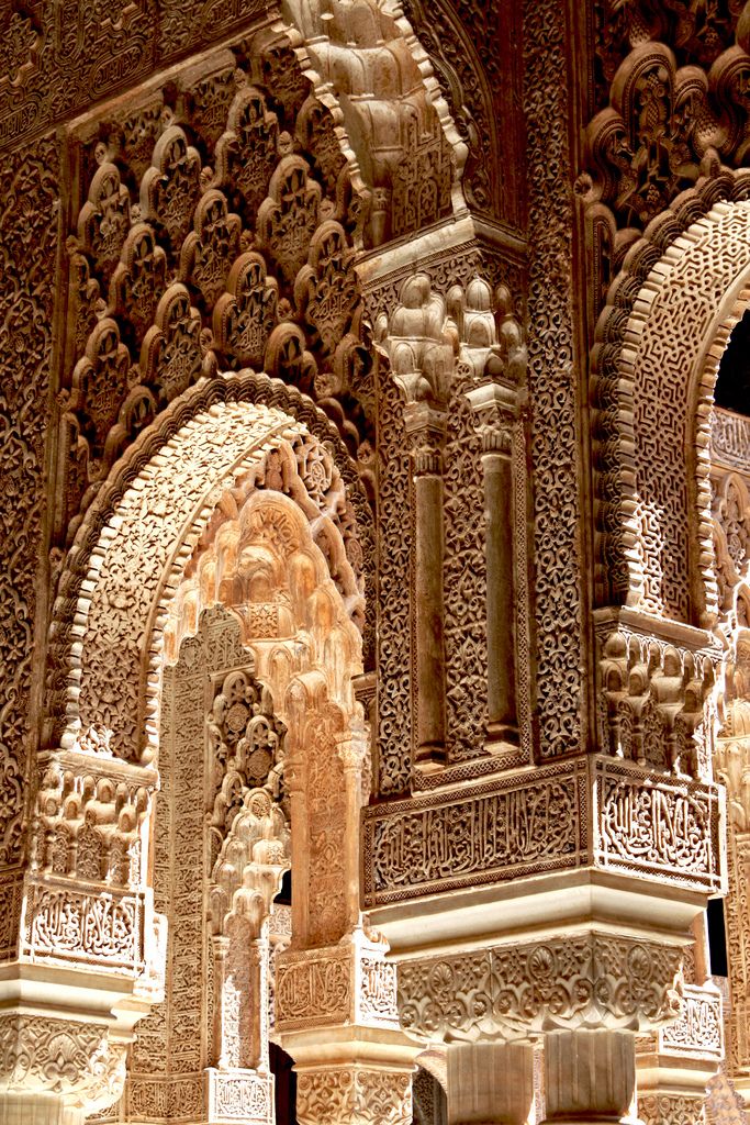 an intricately carved building with columns and arches on the outside wall, in morocco