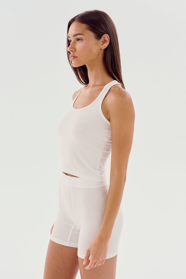 A cropped version of our fabulous Ashby tank. Super soft baby rib fabric hugs your body and layers effortlessly. BEST FOR: running, yoga, CrossFit, barre, Pilates, spin class, cycling and gym workouts. White Fitted Crop Top With Moisture-wicking, Athleisure Crop Top With Minimal Stretch For Workout, Compressive Summer Tank Crop Top, Compressive Tank Crop Top For Summer, Summer Compressive Tank Crop Top, Sporty Fitted Tank Top For Yoga, Yoga Tank Top Bra Friendly Minimal Stretch, Functional Crop Top For Light Exercise In Summer, White Ribbed High Stretch Tank Top