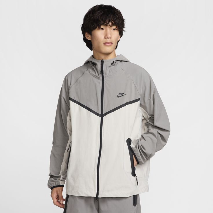 Crafted with stretchy, breathable material, the Nike Tech Woven Jacket offers you ease of movement and adjustable details. Bungee cords with cord locks create a custom fit at the hem and hood. Nylon Techwear Outerwear With Moisture-wicking, Moisture-wicking Nylon Techwear Outerwear, Moisture-wicking Nylon Windbreaker Techwear, Nylon Moisture-wicking Techwear Windbreaker, Casual Breathable Track Jacket For Outdoor, Technical Hooded Nylon Track Jacket, Winter Nylon Breathable Track Jacket, Winter Nylon Track Jacket With Breathable Material, Winter Breathable Nylon Track Jacket