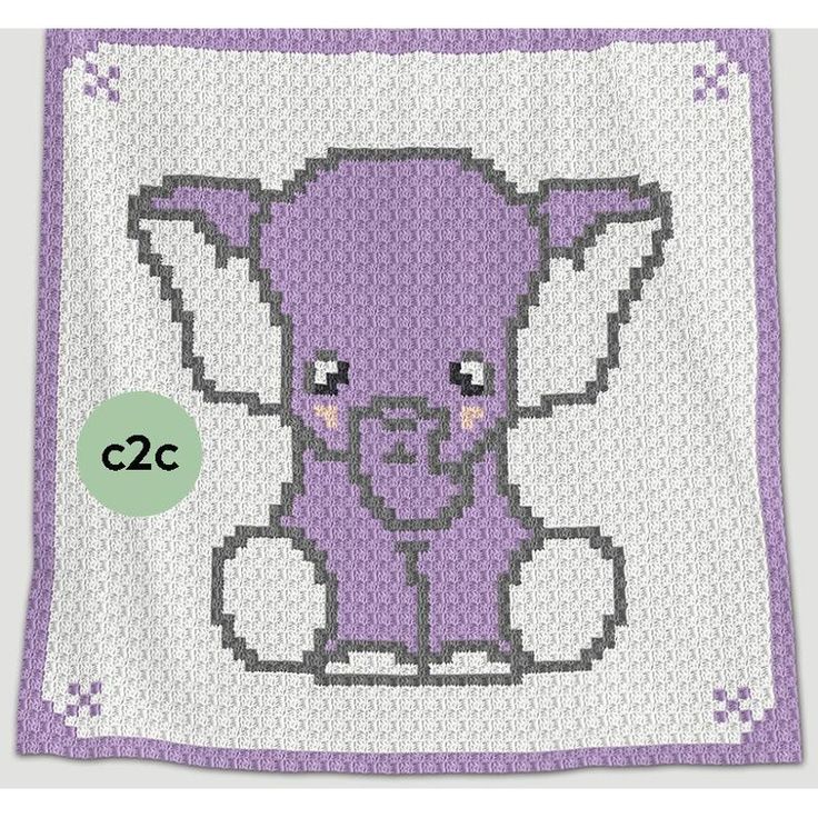 a purple and white crocheted blanket with an elephant design on the front side