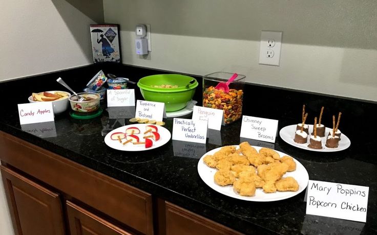 a counter topped with plates filled with food