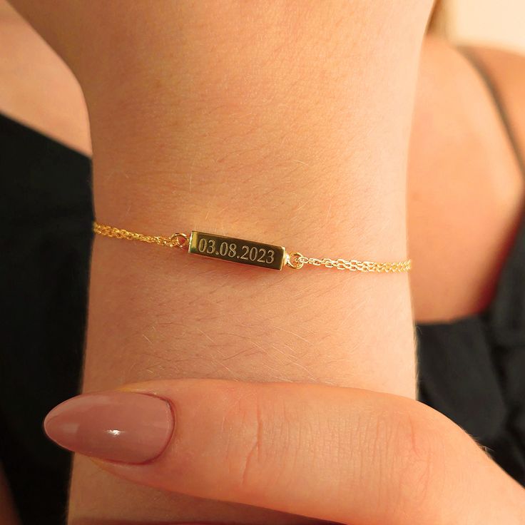 A Timeless Tribute: Memorial Bar Name Bracelet Honor the memory of a loved one with our Memorial Bar Name Bracelet, a cherished keepsake available in Silver or 14K Gold. This bracelet allows you to carry the memory of your beloved with you, creating a lasting tribute that's both elegant and deeply meaningful. ✨ Memorial Keepsake: The discreet bar design conceals a precious compartment, allowing you to hold a small portion of ashes or a meaningful keepsake close to your heart. 📅 Date of Remembra 14k Gold Name Bracelet With Engraving For Anniversary, Minimalist Name Bracelet With Engraving For Anniversary, Minimalist Engraved Name Bracelet For Anniversary, 14k Gold Rectangular Name Bracelet For Gift, 14k Gold Rectangular Name Bracelet As Gift, 14k Gold Rectangular Name Bracelet, Gold Engraved Bracelet For Anniversary, Dainty Engraved Gold Bracelet As Gift, Dainty Engraved Gold Bracelet Gift