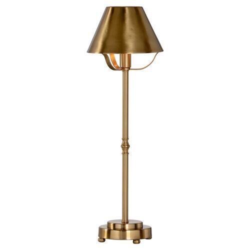 a brass colored floor lamp on a white background