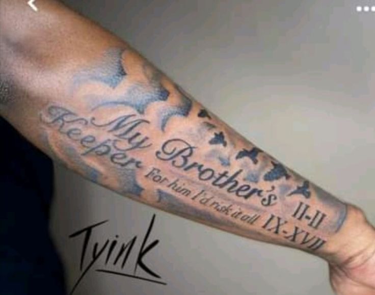 a man with a tattoo on his arm that says, my brother's keeper