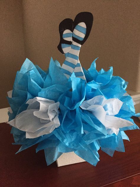 a blue and white paper ball decoration on a table