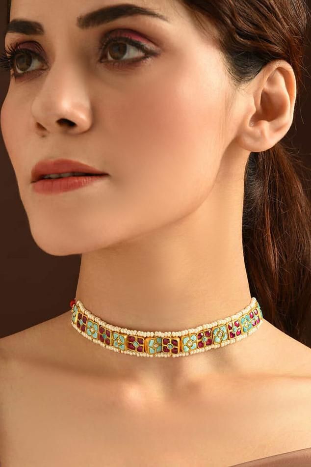 92.5 silver, 18kt gold plated handmade single lined multi colored choker, embellished with kundans.
Type: Kundans
Composition: 92.5 Silver
Color: Red
Other Details: 
Geometric motifs
Dimensions: Length: 5 inches
Weight (in gms): 55
Closure: Adjustable drawcord - Aza Fashions Jewellery Kundan, Choker Jewellery, Necklaces Choker, Jewellery Necklaces, Choker Gold, Geometric Motifs, Red Necklace, Single Line, Jewelry Choker