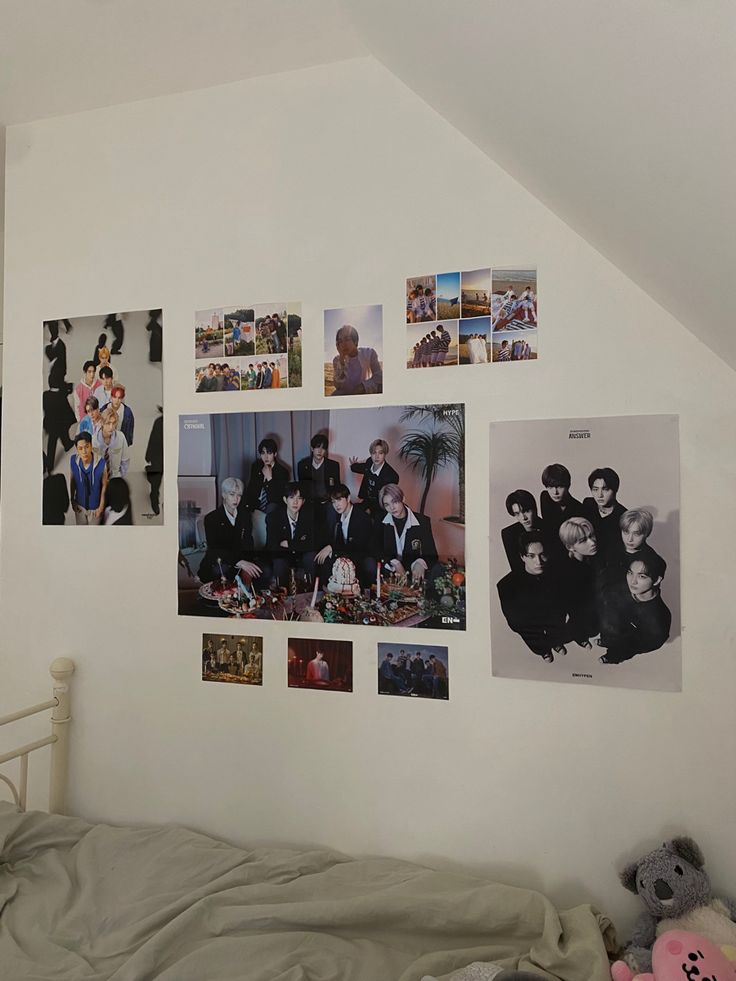 a bedroom with many pictures on the wall