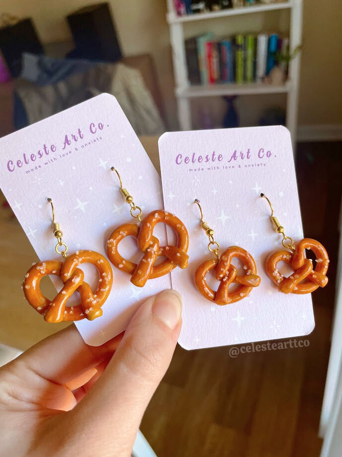 the earrings are shaped like pretzels