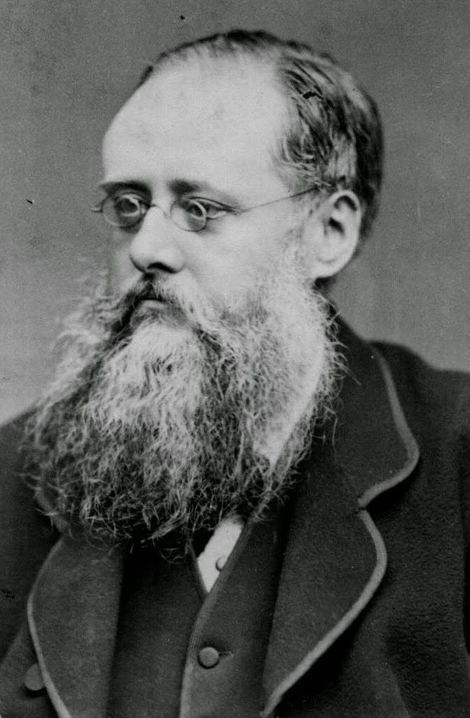 an old black and white photo of a man with a beard