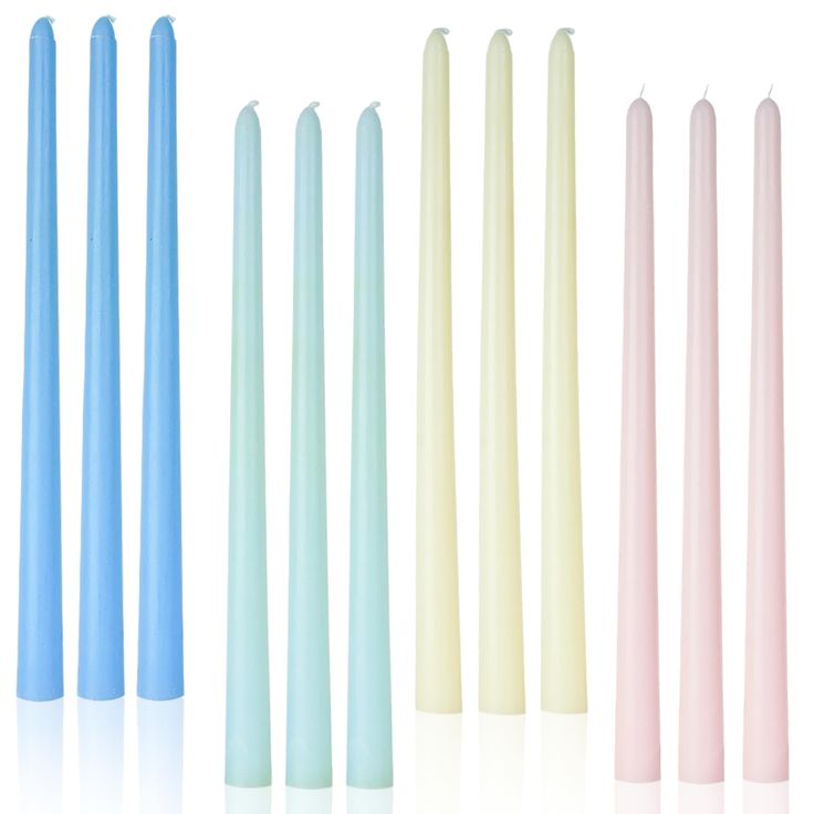 five different colored candles lined up in a row