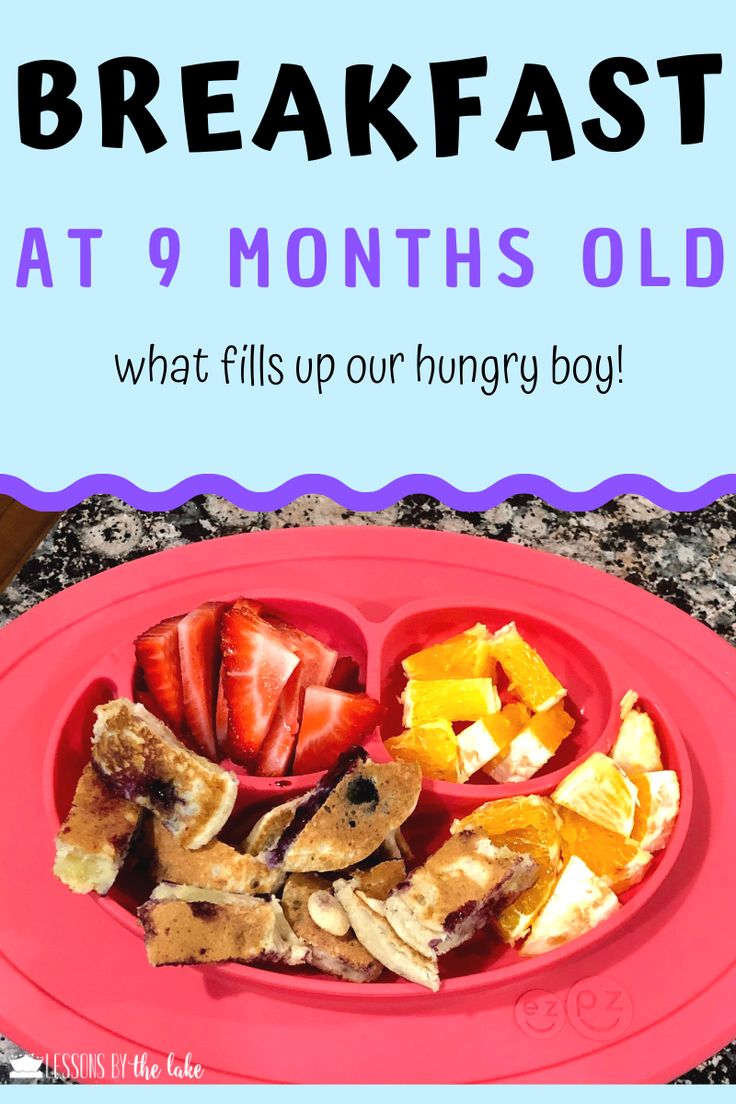 a red plate topped with fruit and vegetables next to a blue sign that says breakfast at 9 months old