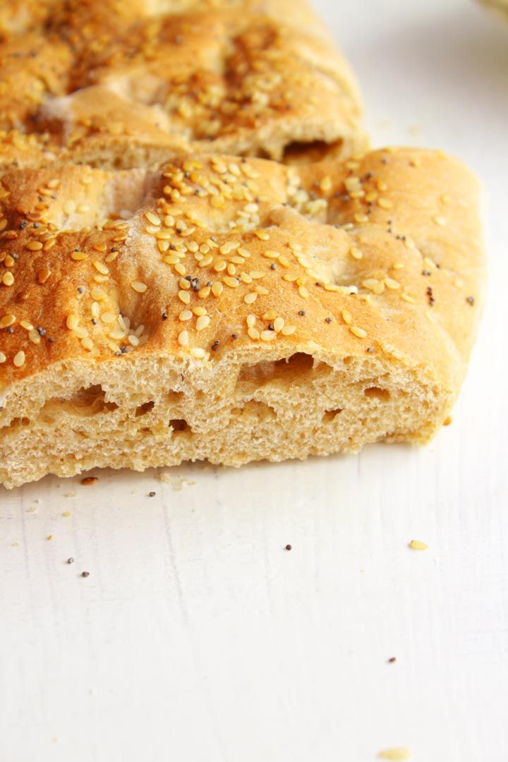 two pieces of bread with sesame seeds on top