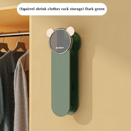 a bear shaped object is mounted on the wall next to a coat rack and clothes