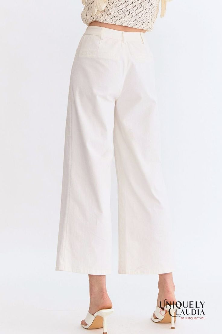 The Kelly Off-White Culotte Pants are high-waisted with a flattering wide-leg silhouette. They feature convenient front pockets and chic faux pockets at the back, adding a touch of sophistication. The front zipper closure and belt loops offer a versatile fit, while the lightweight, woven fabric ensures comfort without compromising on style. These non-sheer pants are unlined, making them perfect for any season. - Unlined - 97% Cotton, and 3% Spandex - Wash Cold. Do Not Bleach. Line Dry. - Importe White Wide Leg Pants With Elastic Waistband, White Bottoms With Elastic Waistband For Work, White Elastic Waistband Bottoms For Work, Modern High-waisted Wide Leg Pants For Spring, Modern White Ankle-length Wide Leg Pants, White Versatile Pants With Elastic Waistband, Versatile White Pants With Elastic Waistband, Chic Wide Leg Cotton Culottes, White High Waist Wide Leg Pants With Elastic Waistband