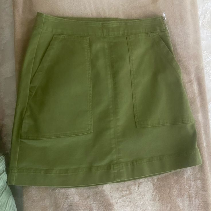 Army Green Short Skirt With From Pockets And A Side Zipper. Very Cute And Perfect For Spring-Summer. New With Tags. Ask Me Any Questions! Spring Stretch Mini Skirt With Pockets, High Waist Utility Skort For Summer, Green Cotton Skirt With Pockets, Casual Green Skirt With Pockets, Casual Cotton Mini Skirt For Spring, Casual High Rise Cotton Skort, Casual High-rise Cotton Skort, High Rise Mini Skirt For Summer Workwear, Casual Green Skirt