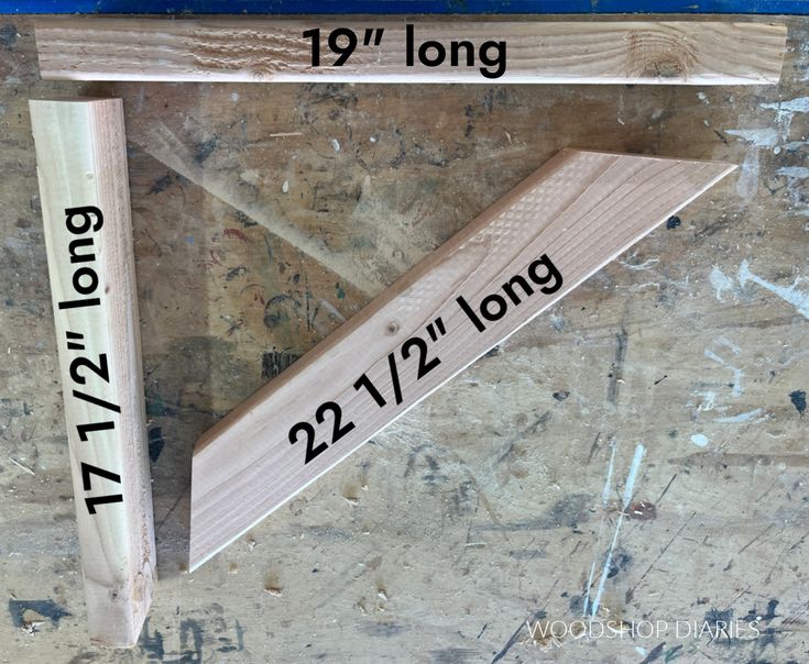 a pair of wooden dows with measurements on them