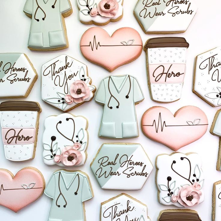 decorated cookies are arranged in the shape of doctors and nurse's coats with flowers on them