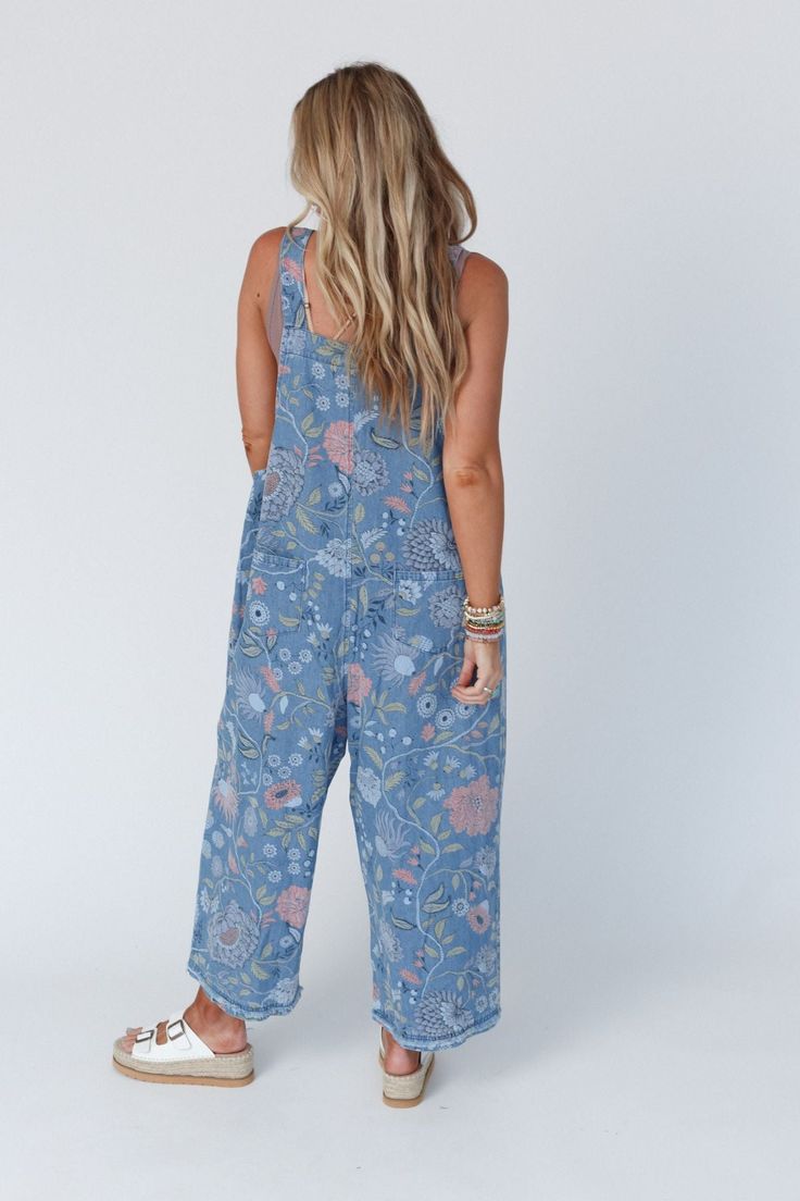 The newest addition to our High Hopes Overall Collection is the High Hopes Slouchy Denim Overalls in an eye-catching floral print! You're going to love these because they feature: Comfortable denim fabric with so cute floral print throughout Oversized, slouchy, loose overall silhouette for the ultimate comfort Wide pant legs at a cropped length Adjustable button straps (3 length options) for the perfect fit Patch pockets along the front bodice and along the backside Effortless boho outfit comfor Cotton Bottoms With Floral Print, Bohemian Cotton Jeans For Summer, Bohemian Style Cotton Summer Jeans, Bohemian Summer Cotton Jeans, Casual Indigo Jeans For Spring, Casual Relaxed Fit Floral Print Bottoms, Casual Patterned Bottoms With Floral Print, Casual Cotton Jeans With Floral Print, Casual Floral Print Patterned Bottoms