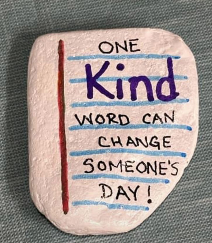 a rock with writing on it that says, one kind word can change someone's day