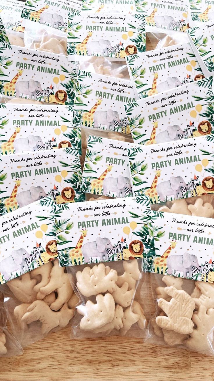 several bags of party animals on a wooden table