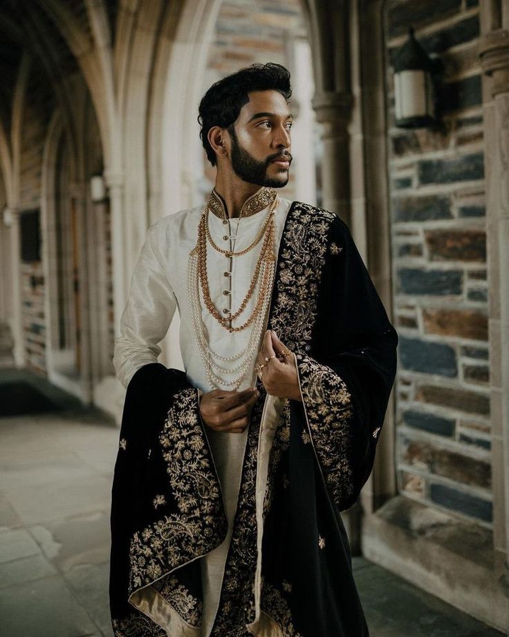 a man in a white and black outfit