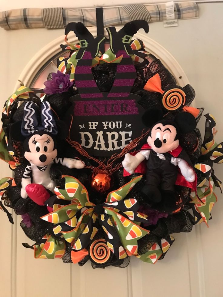 mickey and minnie mouse halloween wreath hanging on the front door