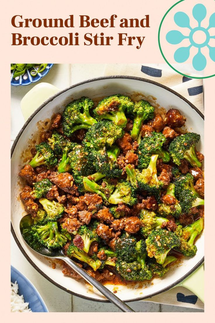 broccoli and beef stir fry in a pan with a spoon on the side